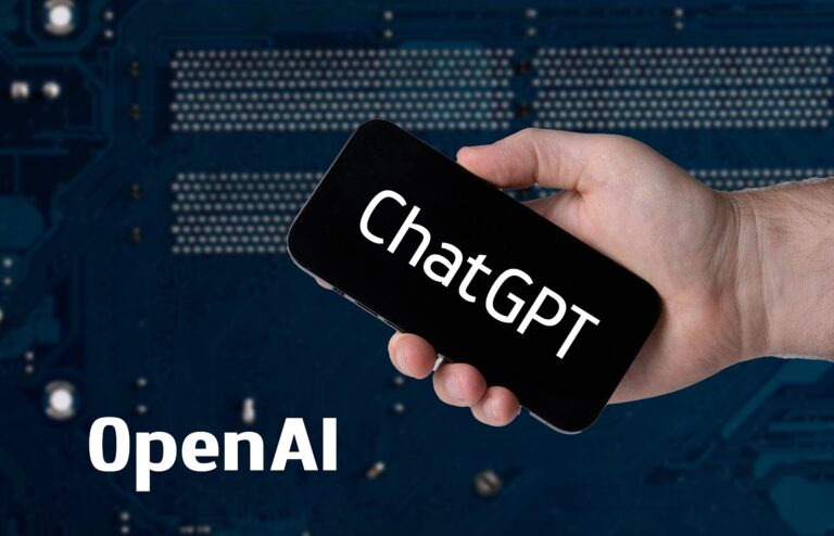 Hand_holding_smartphone_with_ChatGPT_and_OpenAI_text_52917312010.jpg